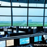 Home 19 항공운항관리사와 공항 관계자 협력 - A highly detailed and realistic scene inside a busy Vietnamese airport air traffic control tower, sh...